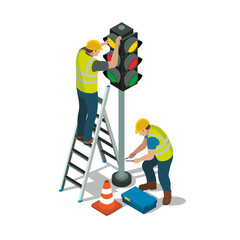 Two workers in safety gear are repairing traffic light. One is on ladder adjusting light, while other is on ground with tools. traffic cone and toolbox are nearby