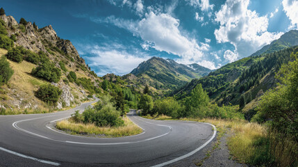 Fototapeta premium Majestic winding mountain road surrounded by lush greenery under a bright blue sky