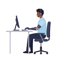 Man with prosthetic arm typing at office computer