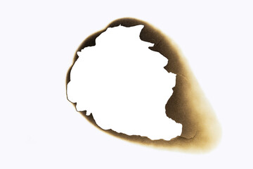 A large, irregular burnt hole in white paper, with scorched edges creating an abstract frame. A...