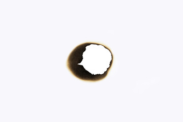 A burnt hole in a sheet of white paper, creating a scorched and charred frame. A realistic fire...