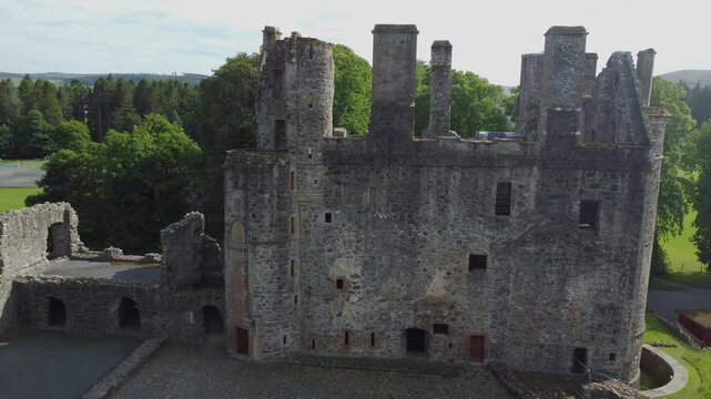 slow arial drone footage of scottish huntly castle ruin epic dramatic views closeup abandoned building tourist attraction no people