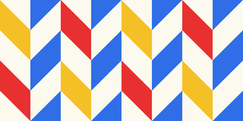 Seamless herringbone vector pattern in red, yellow, and blue tones