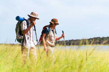 Man and woman are enjoy seeing a beautiful landscape and lake view.