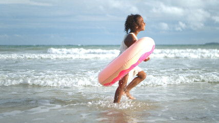 Portrait of children enjoying a playful walk on the beach