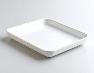 Empty white rectangular dish on plain background