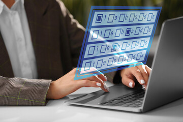 Woman passing online test on laptop at table, closeup. Virtual form above computer