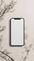 Modern smartphone with blank screen surrounded by delicate white flowers and soft shadows on a textured background. Ideal for app design, UI showcase