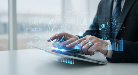 Businessman interacting with digital interface on a tablet representing futuristic technology and data