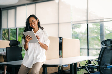 Smiling asian successful business woman, freelancer, coworker female leader using digital device