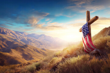 cross with the American flag of USA on top of the mountain at the grave of the patriots at sunrise. Memorial Day for Victims and Veterans of War in America