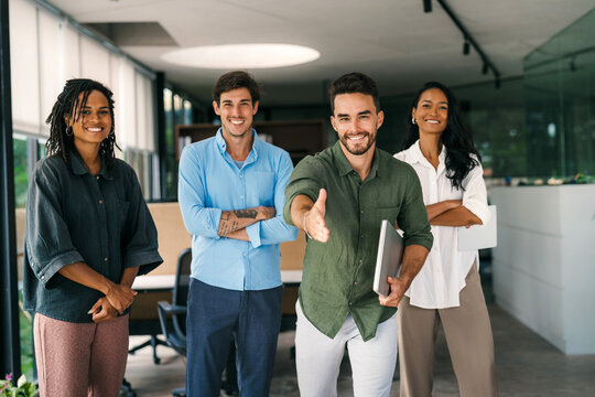 Happy office staff, success employee giving hand for shaking. Business people offering handshake