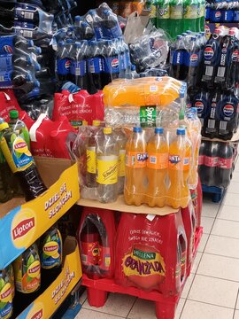 Assortment of Bottled Drinks on Display in a Supermarket