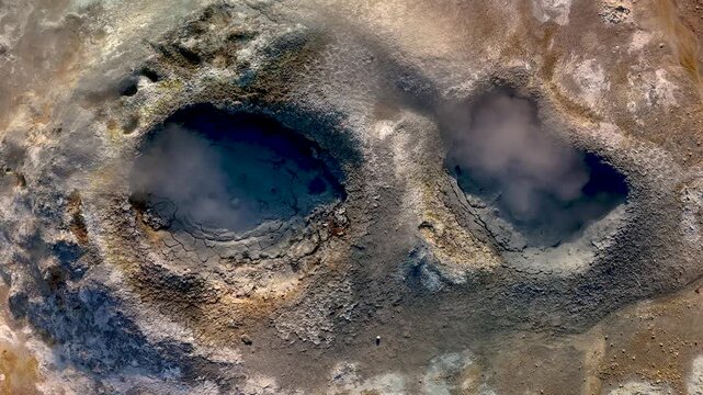 Explore the stunning geothermal activity in Iceland, featuring steaming craters that reveal the raw power of nature. Hverir geothermal area in Iceland