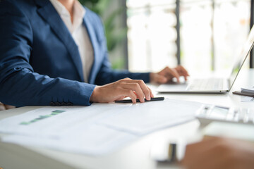 Businessmen working together at desk.