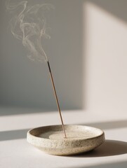 Burning Incense Stick in Speckled Ceramic Holder