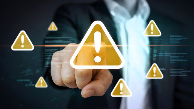 Urgent warning alert delivered by a decisive finger pointing towards a digital interface highlighting critical business risks and cybersecurity threats.