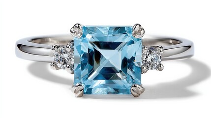 Elegant silver featu a large square-cut blue gemstone center with two small side diamonds on a plain white background