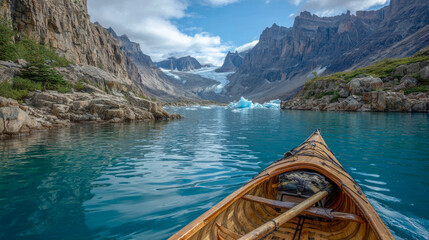Paddling through a serene glacier lake surrounded by towering cliffs, icebergs drift lazily under a moody sky. The cold air enhances the breathtaking beauty of this Arctic adventure