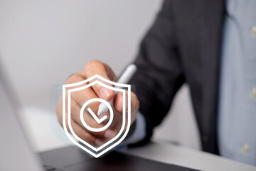 Businessman uses digital pencil to enter code to protect business and financial data with cloud...