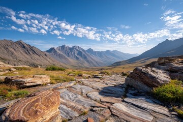 Scenic Mountain Landscape with Dramatic Rock Formations and Clear Blue Sky, Beautiful Natural Environment Captured in Serene Wilderness Setting