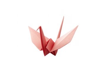 A pink origami crane crafted from paper, showcasing precise folds and sharp edges.