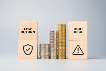 Visual comparison of low return and high risk financial strategies using wooden blocks and stacked...