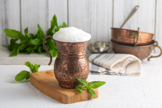 Glass cup of Turkish traditional drink ayran , kefir or buttermilk made from yogurt, healthy food
