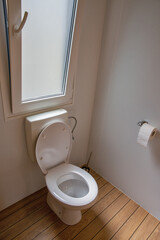 Small bathroom with wooden floor and window