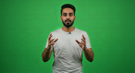 Man presenting against green screen