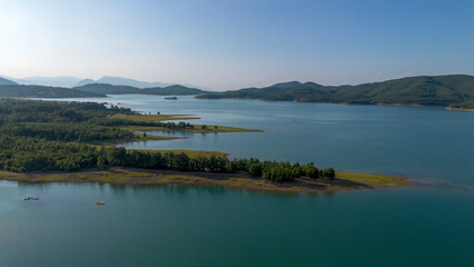 Obraz premium Plastiras Dam, an arch dam in the Karditsa regional union of Greece, which flows into the Tavropos River, forming the artificial Plastiras lake.