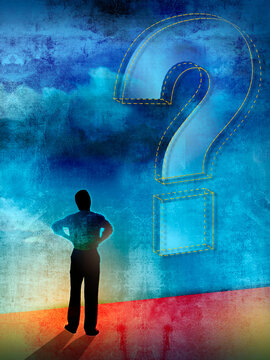 Man looking up at question mark in sky