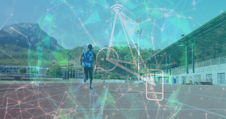 Running male teenager in blue sleeveless top, black shorts on track, with clock phone signal icons