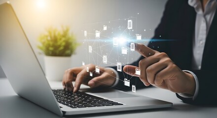Businessman interacting with digital network of files and folders on a laptop