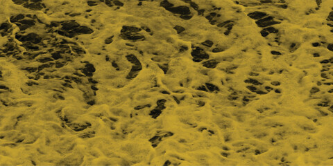 Abstract textured background featuring a golden yellow sponge like surface with dark pockets and a rough organic appearance