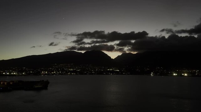 USA, Hawaii, Maui, Kahului Bay - at nightfall last sunlight few stars overlooking illuminated houses port wharf and harbor
