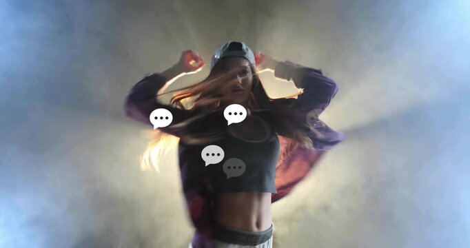 Spotlight activating dancer shifting weight, whipping hair and revealing midriff in dance showcase