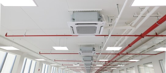 Fire sprinkler and red pipe.Install fire sprinkler system. In the industrial plant warehouse, pipe...