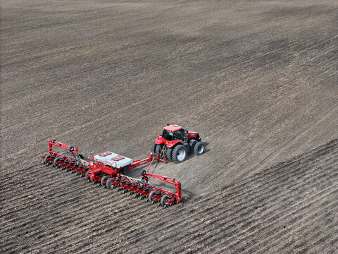 Ottawa, Illinois - USA -  April 29, 2025 Case IH 290 magnum tractor pulling a Case IH 1250 24 row planter