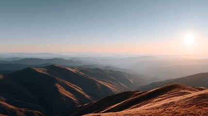 Scenic Landscape at Sunrise with Rolling Hills and Soft Hues across Distant Mountains