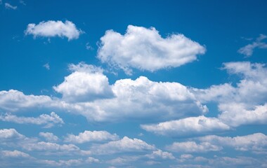 Fototapeta premium A clear blue sky with fluffy white clouds