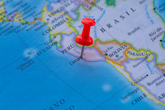 PUERTO MONTT, CHILE - JUL 24, 2025: Peru marked on political map with red pushpin travel and analysis concept