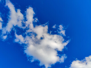 A blue sky with some white clouds in it