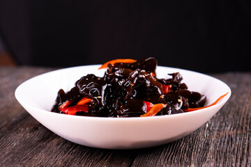 Wood Ear Mushroom Salad on wooden background. Chinese food. Asian cuisine