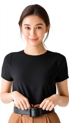 Young Woman Adjusting Textured Belt on Waist While Smiling Confidently Against White Background