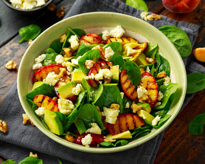 grilled peach spinach salad with feta and avocado
fresh summer salad with nuts and sweet fruit
healthy vegetarian bowl with colorful ingredients