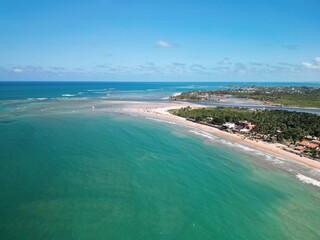 Aerial view of Pontal de Maraca&iacute;pe in Porto de Galinhas, Brazil, with crystal clear sea, natural pools, jangada boats and paradise beach in the northeast coast &ndash; drone photography