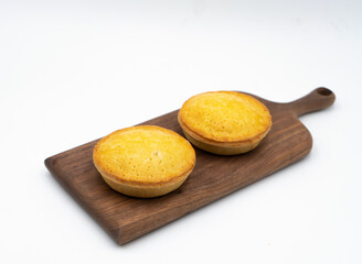 Golden Creamy Chicken Mushroom Pies on Wooden Board side view of Savory Baked Goods