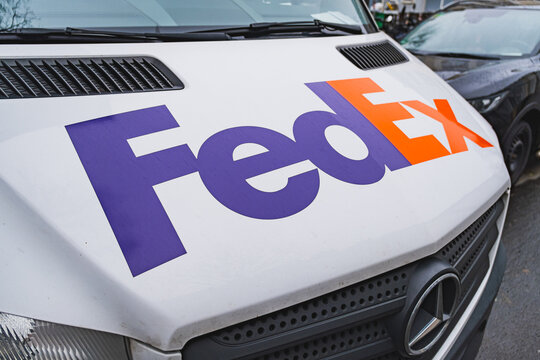 FedEx express parcel delivery company logo and branding on a delivery van