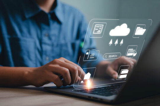 Person using laptop with holographic weather forecast interface